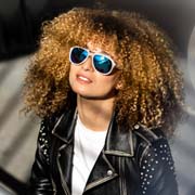 Female model looking great in Bolle Cobalt 12530 sunglasses matt beige with TNS Ice lenses. Side-shields removed.